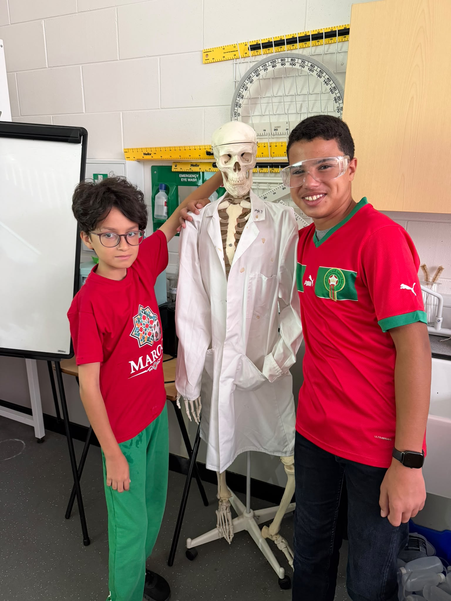 Students exploring a skeleton model together